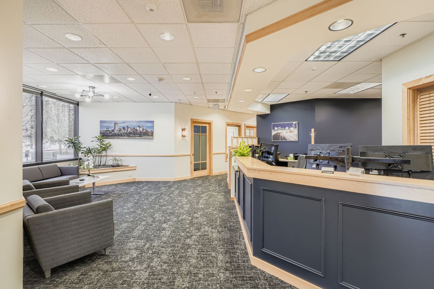 Modern office reception area with comfortable seating and professional ambiance for executive business services.