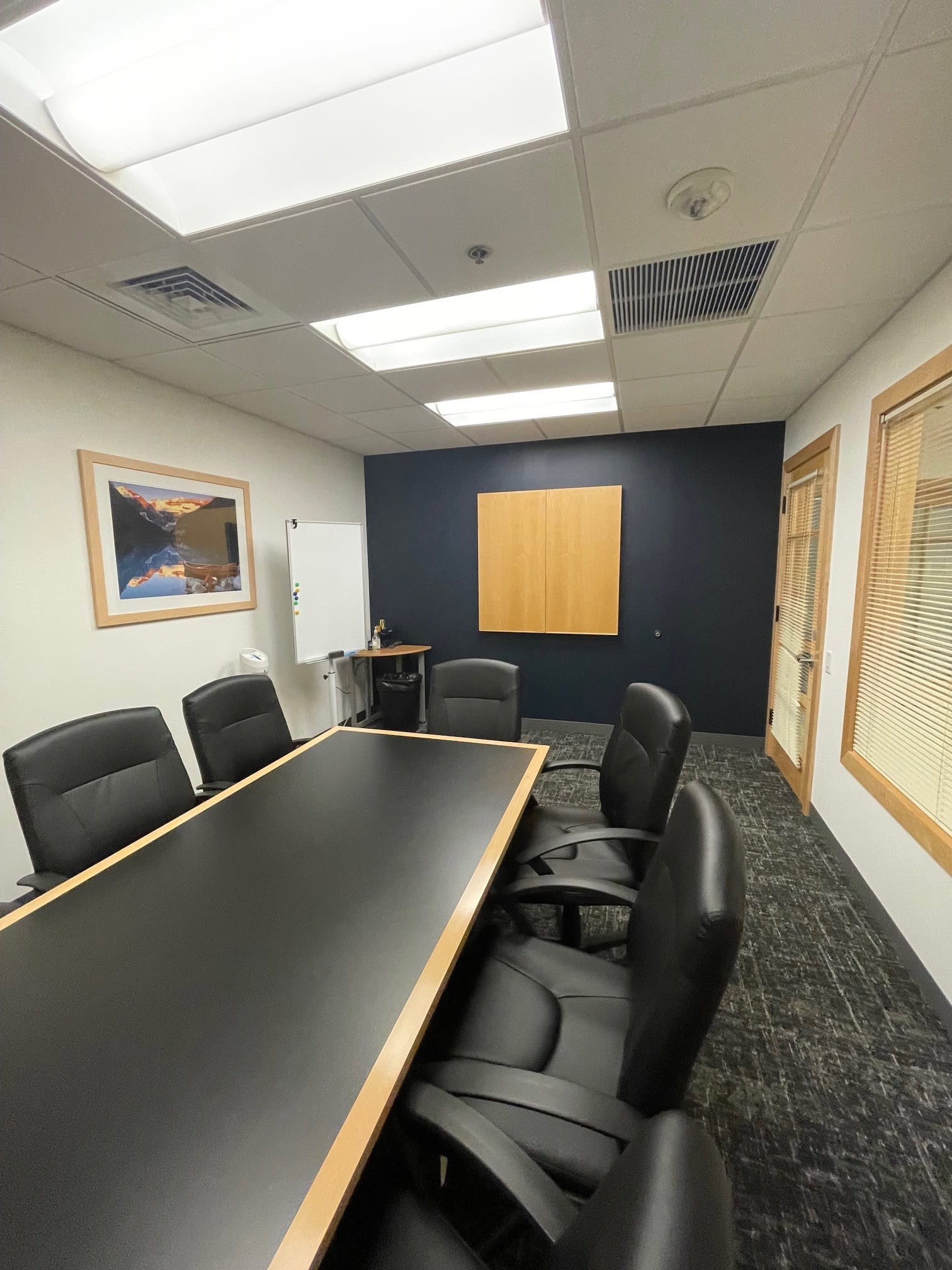 Flexible office meeting room with conference table and chairs in Philadelphia.