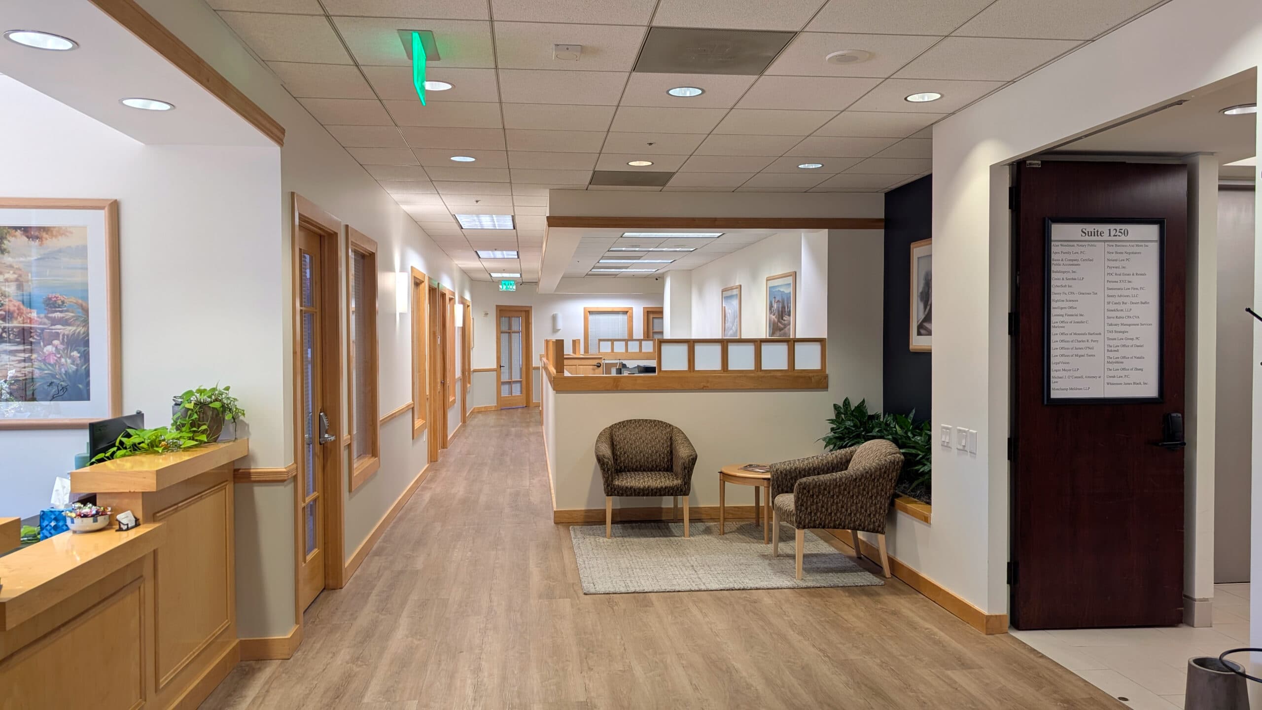 Bright office reception area with comfortable seating and modern decor, ideal for professional business environments.