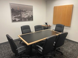 Modern Philadelphia conference room with a sleek black table and comfortable chairs for professional.