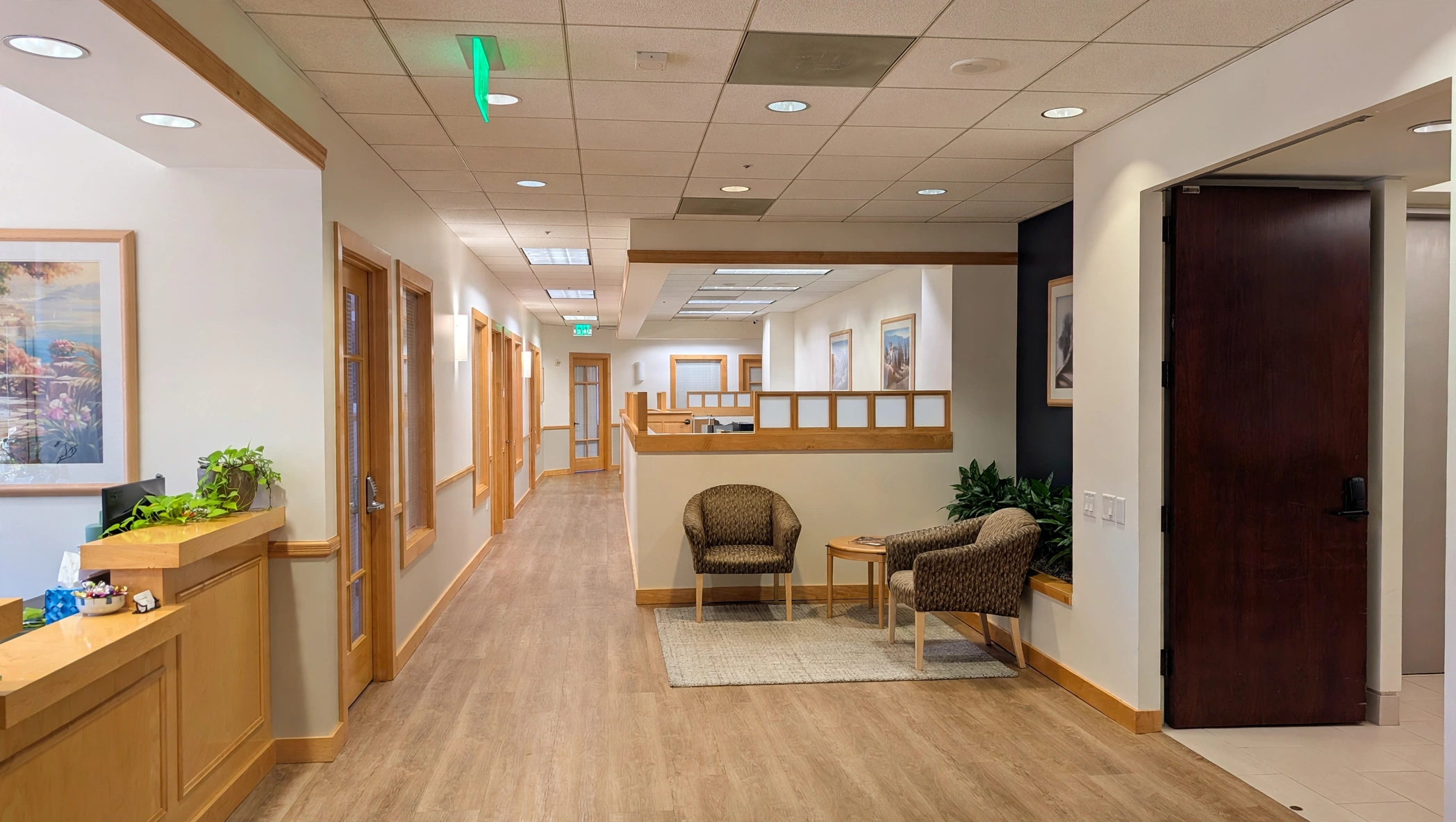 Bright office reception area with comfortable seating and modern decor, ideal for professional business environments.