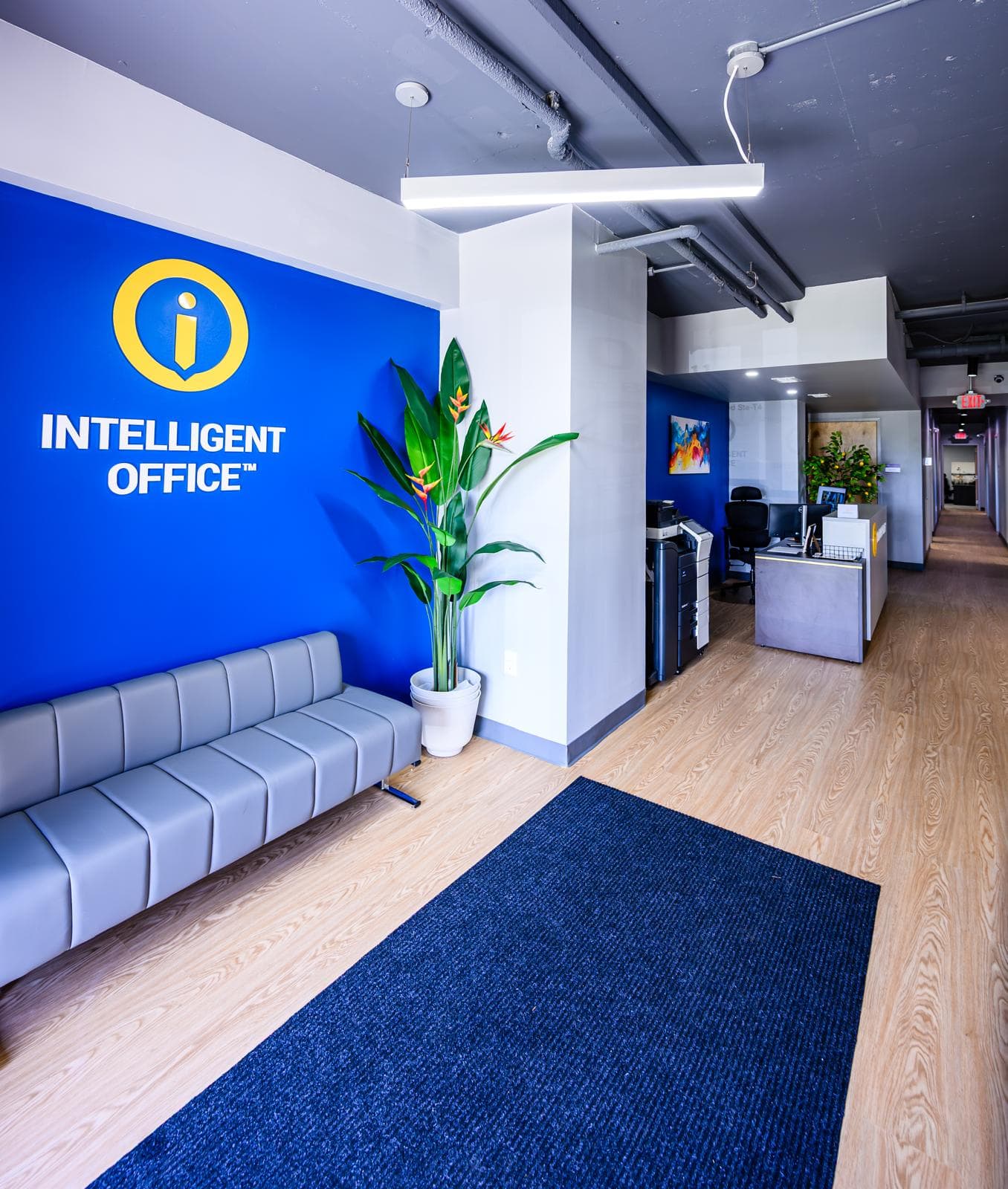 Intelligent Office reception area with modern seating, branding, and a welcoming atmosphere for clie.
